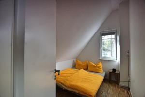 Postel nebo postele na pokoji v ubytování Haus unter den drei Bäumen - Urlaub auf der Sonneninsel Usedom