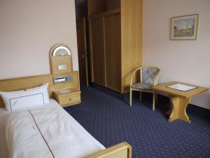 Postel nebo postele na pokoji v ubytování Hotel Ebner