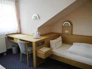 Postel nebo postele na pokoji v ubytování Hotel Ebner