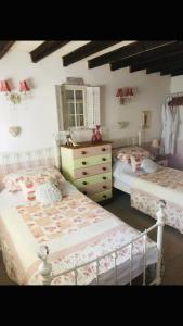 A bed or beds in a room at The Tavern at Timberland 