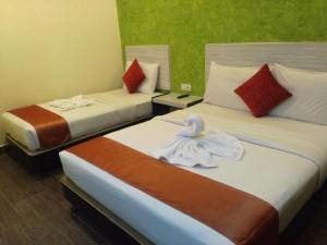 Postel nebo postele na pokoji v ubytování Hotel Westree KL Sentral
