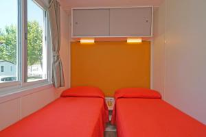 
Een bed of bedden in een kamer bij San Francesco Camping Village

