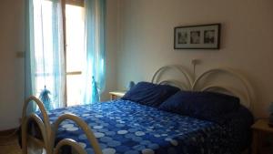 Ein Bett oder Betten in einem Zimmer der Unterkunft B&B "La Camelia"