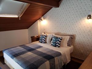 Postel nebo postele na pokoji v ubytování Pousada Annecy - CAPIVARI Fácil acesso ao centrinho e Baden Bar
