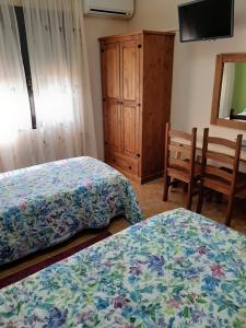 Postel nebo postele na pokoji v ubytování CASA RURAL LA CERCA + 32 fotografií