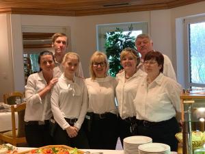 a group of people standing in front of a table at Hotel Restaurant Borchard in Lübbecke