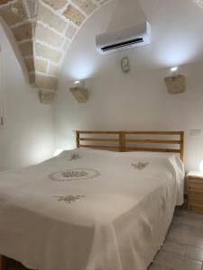 En eller flere senge i et værelse på Il Fenicottero