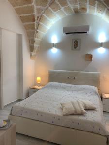 En eller flere senge i et værelse på Il Fenicottero