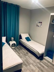 Posteľ alebo postele v izbe v ubytovaní Apartament C18