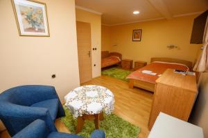 Voodi või voodid majutusasutuse Guest house Mali hotel toas