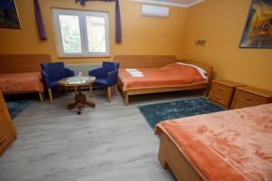 Voodi või voodid majutusasutuse Guest house Mali hotel toas