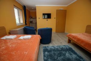 Voodi või voodid majutusasutuse Guest house Mali hotel toas