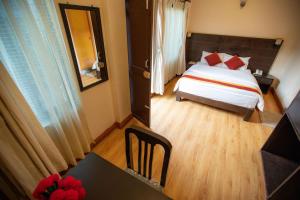 Voodi või voodid majutusasutuse Kathmandu Sunny Hotel toas