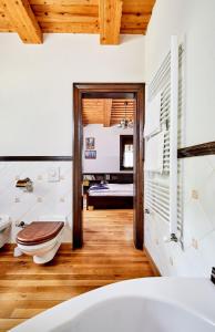 a bathroom with a toilet in a room at Villa Szalamandra - az Erdőszéle in Matraalmas