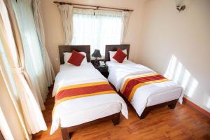 Voodi või voodid majutusasutuse Kathmandu Sunny Hotel toas