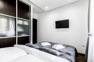 Ένα ή περισσότερα κρεβάτια σε δωμάτιο στο Apartament MAJA 13