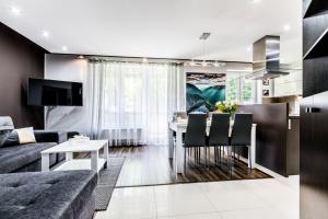 Μια τηλεόραση ή/και κέντρο ψυχαγωγίας στο Apartament MAJA 13