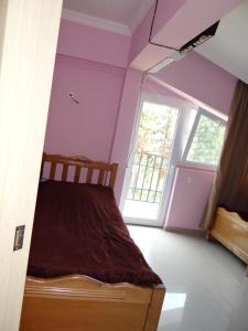 Letto o letti in una camera di Hotel Lotus