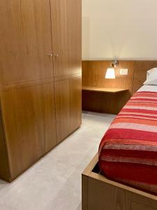 Postel nebo postele na pokoji v ubytování B&B Don Savè