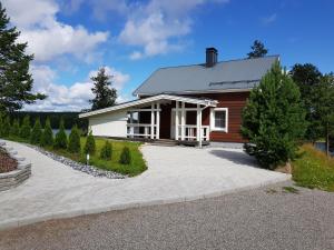 a small house with a driveway in front of it at Ammatour Villas in Uro