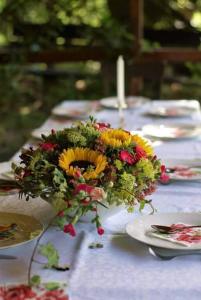 a bouquet of flowers sitting on a table at Agroturystyka Rębowo in Kłodawa