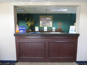 a bar in a room with a green wall at Days Inn by Wyndham Grand Island I-80 in Doniphan