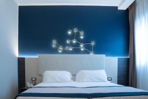 A bed or beds in a room at San Lorenzo - Boutique Hotel & SPA