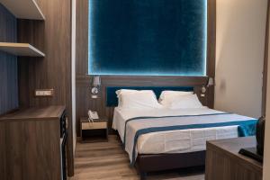 A bed or beds in a room at San Lorenzo - Boutique Hotel & SPA