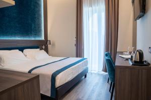 A bed or beds in a room at San Lorenzo - Boutique Hotel & SPA