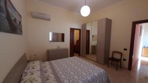 A bed or beds in a room at Appartamento 3