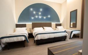 A bed or beds in a room at San Lorenzo - Boutique Hotel & SPA
