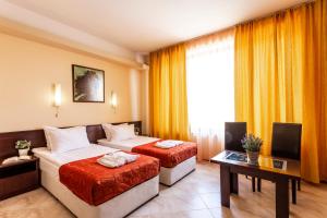 Ένα ή περισσότερα κρεβάτια σε δωμάτιο στο Termo Hotel Aspa Vila