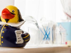 a rubber duck figurine sitting on a shelf at Moss Cottage in Stratford-upon-Avon