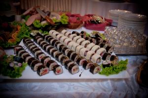 a group of sushi on a plate on a table at Willa Park in Ostrowiec Świętokrzyski