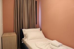 Ліжко або ліжка в номері Hotel Triumf Shengjin