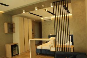 Ліжко або ліжка в номері Hotel Triumf Shengjin