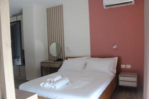 Ліжко або ліжка в номері Hotel Triumf Shengjin