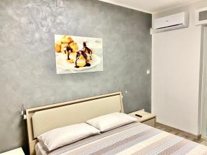 Voodi või voodid majutusasutuse Siclari B&B-Rooms&Suite toas