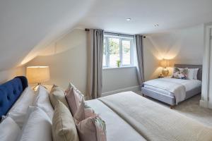 a bedroom with two beds and a window at Host & Stay - Prospect Hill Apartments in Whitby