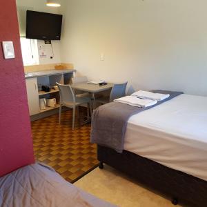 Postel nebo postele na pokoji v ubytování Motel Lodge