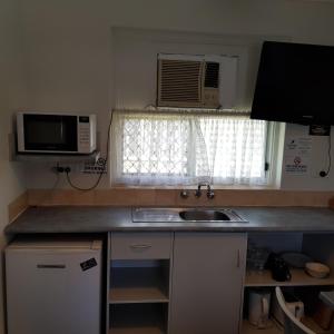 Kuchyň nebo kuchyňský kout v ubytování Motel Lodge