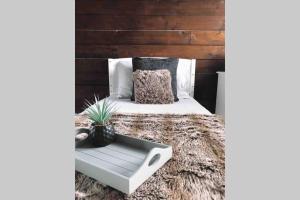 a bed with a coffee table on top of a rug at Seaview House in Aberdeen