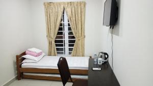 Postel nebo postele na pokoji v ubytování Hotel Mutiara KGMMB, Melaka