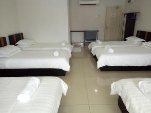 Postel nebo postele na pokoji v ubytování Hotel Mutiara KGMMB, Melaka