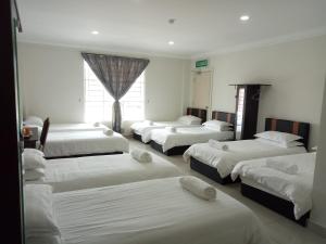 Postel nebo postele na pokoji v ubytování Hotel Mutiara KGMMB, Melaka