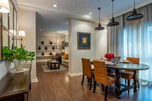 a dining room with a table and chairs at At 21 Saladaeng in Bangkok