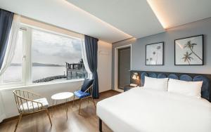 Postel nebo postele na pokoji v ubytování Hotel Hyggelig