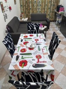 a table with a table cloth on it in a living room at -= Studio Love =- in Xylophaghou