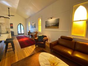 a living room with a couch and a table at The Church at Barrington in Barrington