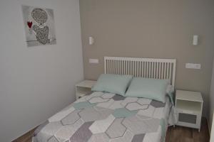Postel nebo postele na pokoji v ubytování CASA SOLORGA - apartamentos rurales